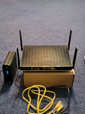 Linksys Black Wireless Router with Yellow Ethernet Cable